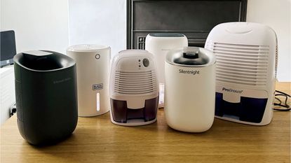 row of dehumidifiers on a wooden table
